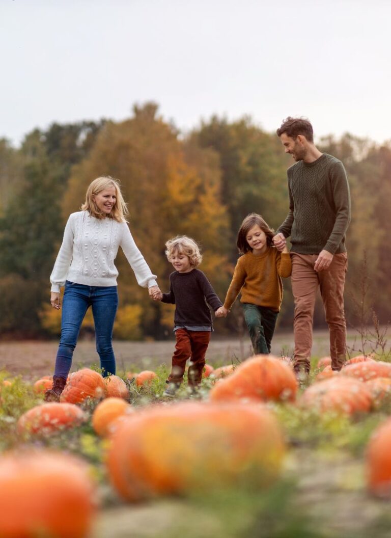 a family on a pumpkin patch